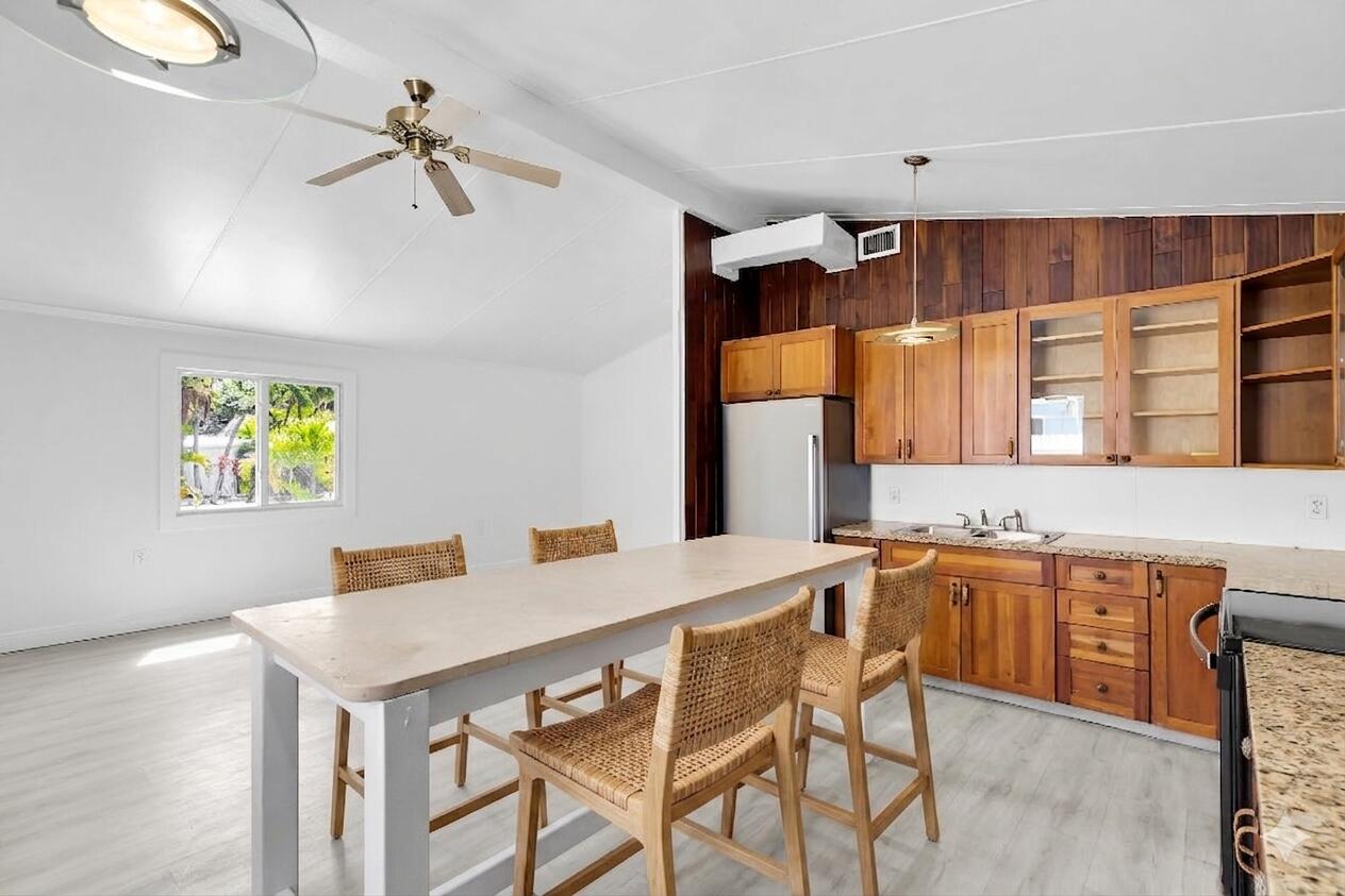 417 95th Street Marathon, FL 33050 - Photo 4 of 28 a view of a kitchen area with furniture and window