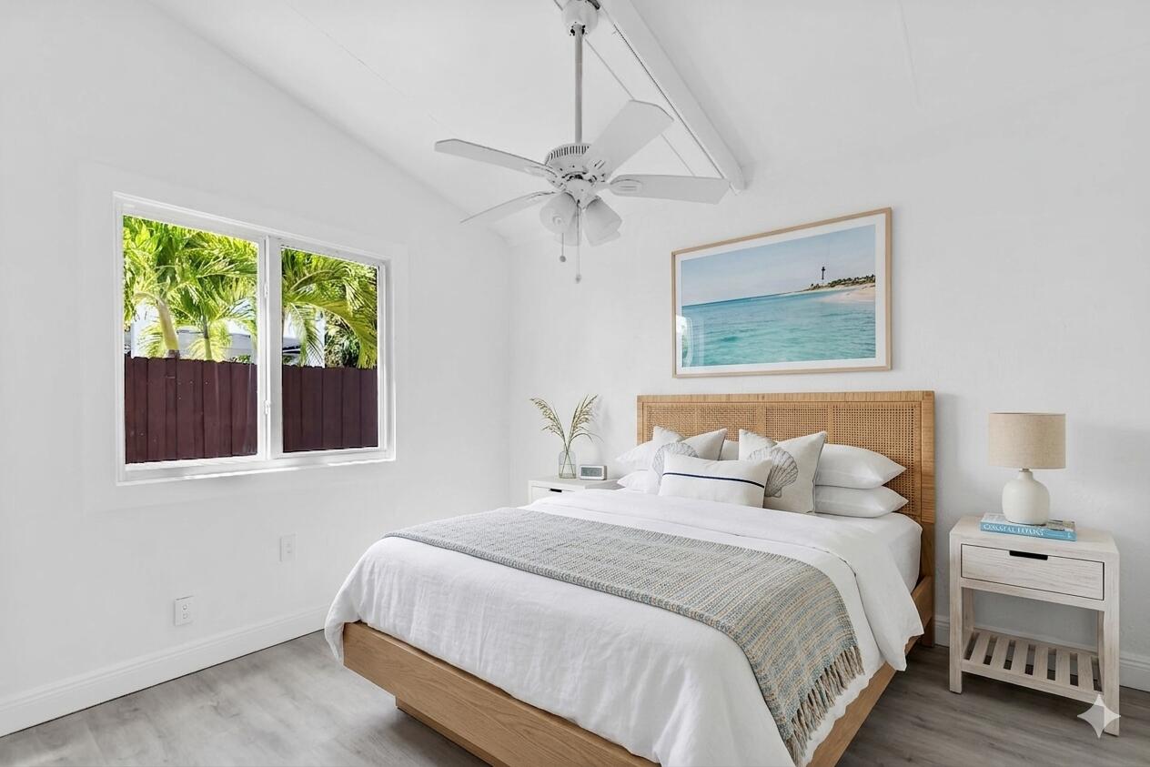 417 95th Street Marathon, FL 33050 - Photo 5 of 28 a bedroom with a large bed and a window