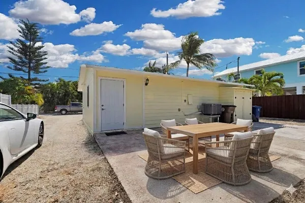 a view of a patio with a table and chairs