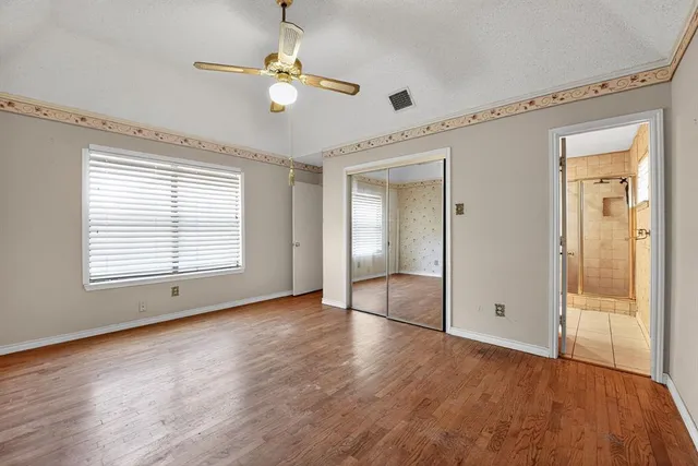 a view of an empty room with a window