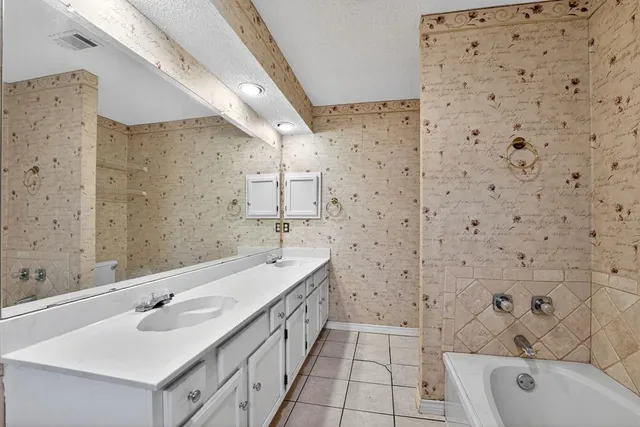 a bathroom with a sink and a bathtub