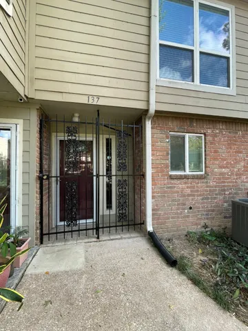 a view of a brick building with a large window