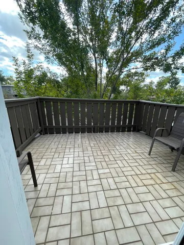 a view of balcony with wooden floor