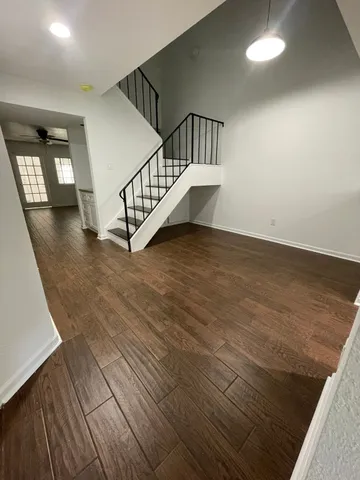 a view of staircase with white walls