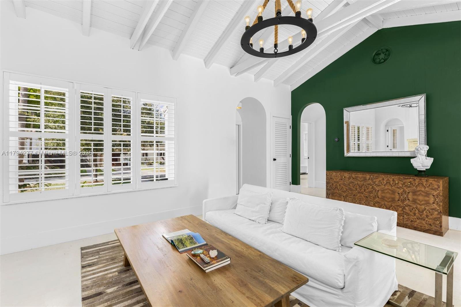 712 Northeast 72nd Street Miami, FL 33138 - Photo 2 of 35 a living room with furniture and a window
