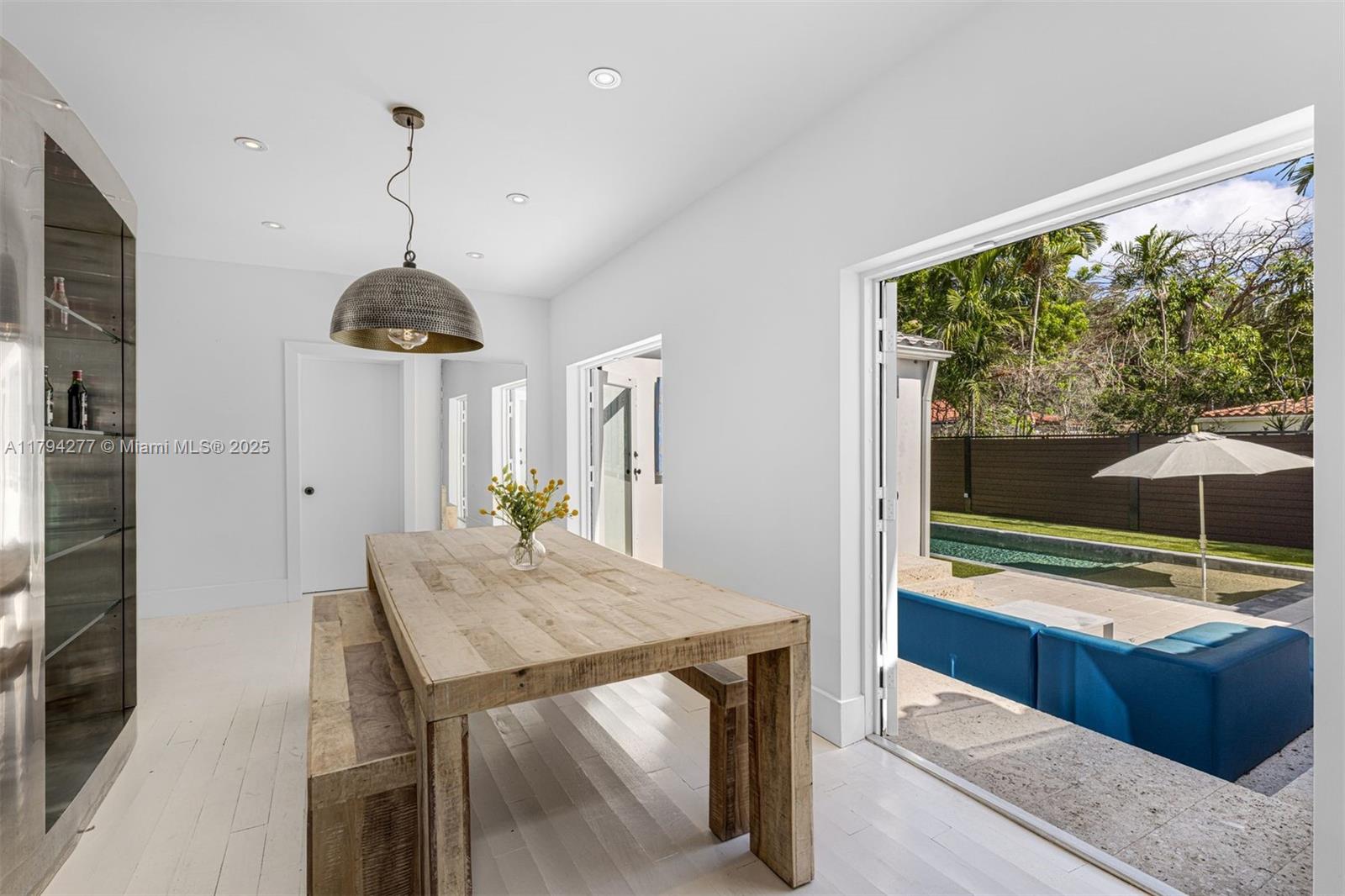 712 Northeast 72nd Street Miami, FL 33138 - Photo 21 of 35 a view of a room with a table and chairs