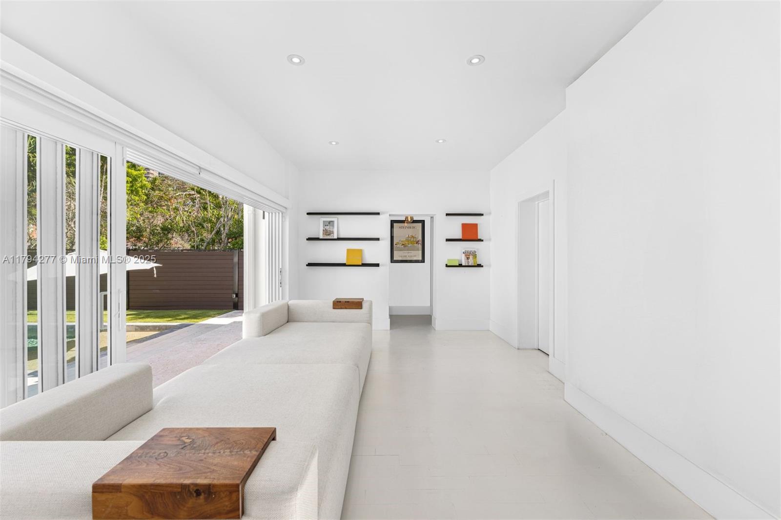 712 Northeast 72nd Street Miami, FL 33138 - Photo 22 of 35 a living room with furniture and a large window