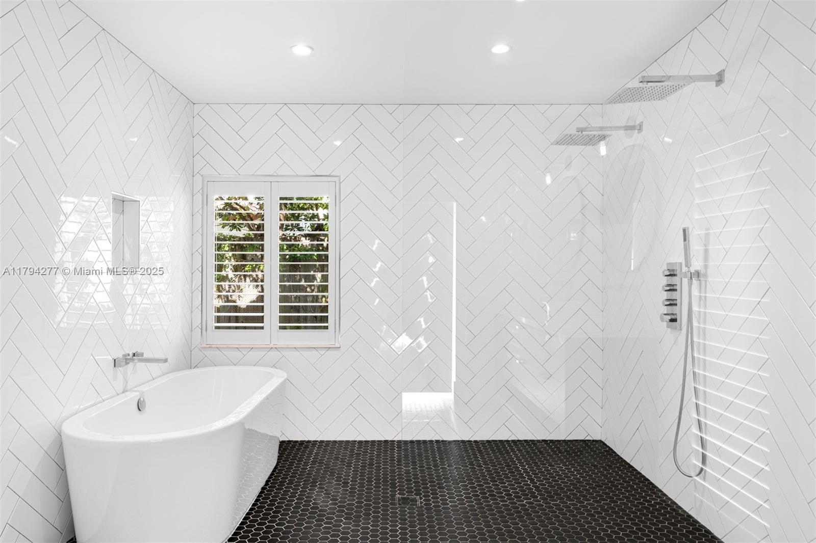 712 Northeast 72nd Street Miami, FL 33138 - Photo 27 of 35 a bathroom with a sink and a shower