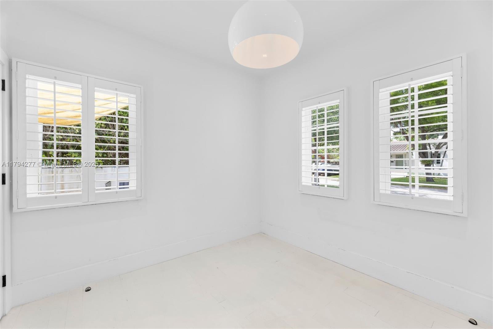 712 Northeast 72nd Street Miami, FL 33138 - Photo 28 of 35 a view of an empty room with a window