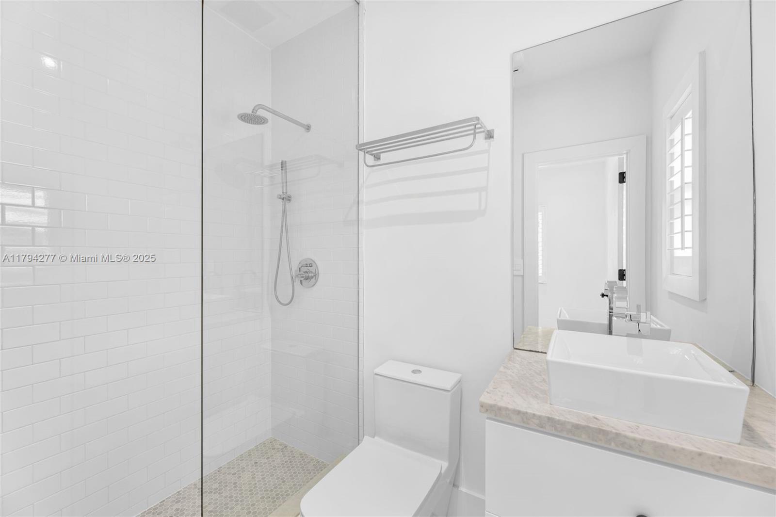 712 Northeast 72nd Street Miami, FL 33138 - Photo 29 of 35 a bathroom with a granite countertop sink toilet and shower