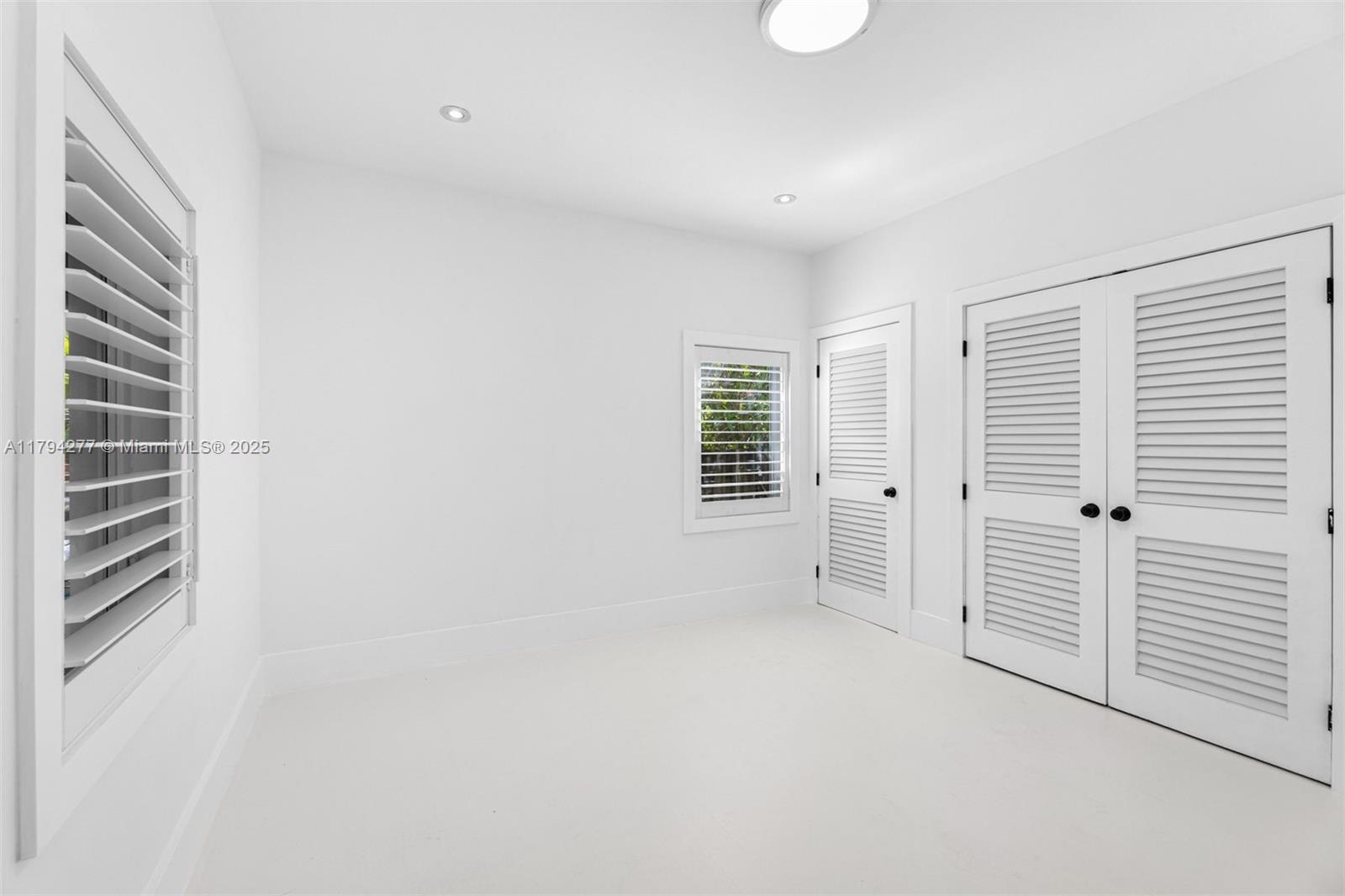 712 Northeast 72nd Street Miami, FL 33138 - Photo 30 of 35 an empty room with windows