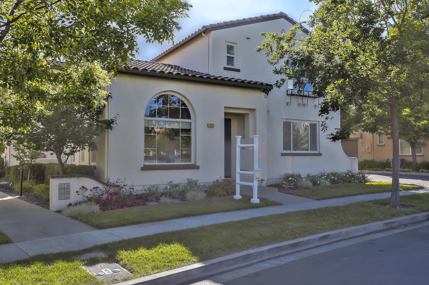 1228 Cedarwood Loop San Ramon, CA 94582 - Photo 1 of 1 a front view of a house with a garden