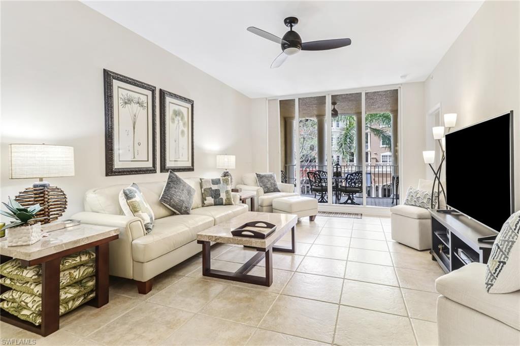 401 Bayfront Place, Unit 3205 Naples, FL 34102 - Photo 2 of 35 a living room with furniture a flat screen tv and a window
