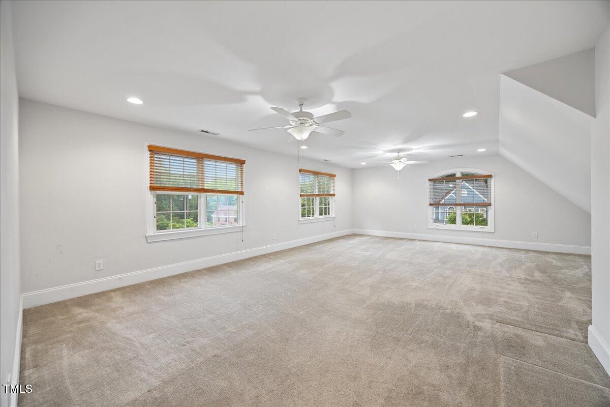 2507 Mayview Road Raleigh, NC 27607 - Photo 42 of 53 Huge bonus over the garage. Only carpeted area.