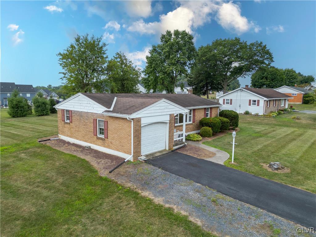 407 Cherry Hill Road Nazareth, PA 18064 - Photo 14 of 45 a front view of a house with a yard and garage