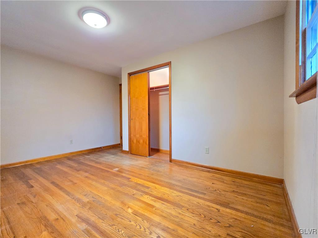 407 Cherry Hill Road Nazareth, PA 18064 - Photo 17 of 45 an empty room with wooden floor and windows