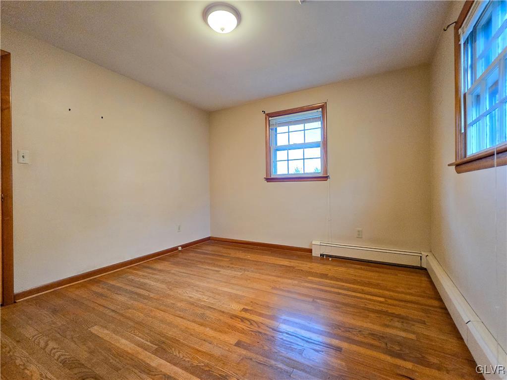 407 Cherry Hill Road Nazareth, PA 18064 - Photo 20 of 45 an empty room with wooden floor and windows