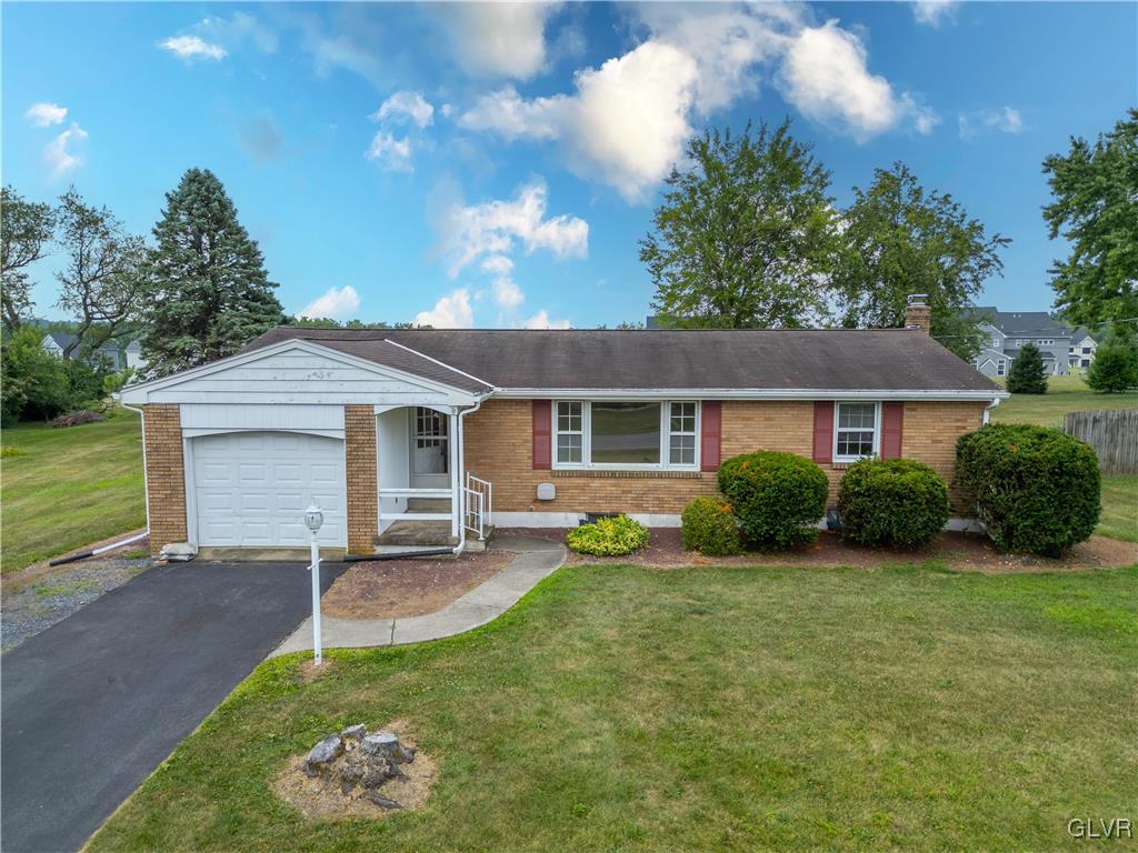 407 Cherry Hill Road Nazareth, PA 18064 - Photo 2 of 45 a front view of a house with a yard and garage