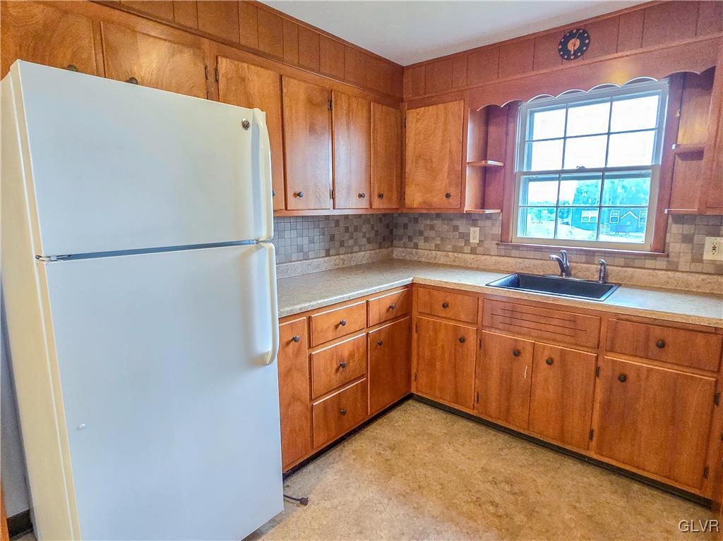 407 Cherry Hill Road Nazareth, PA 18064 - Photo 23 of 45 a white refrigerator freezer sitting inside of a kitchen