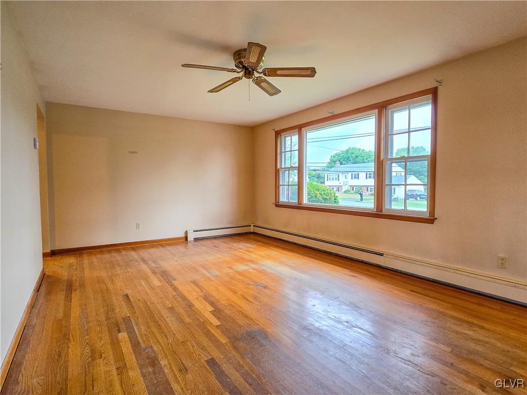407 Cherry Hill Road Nazareth, PA 18064 - Photo 28 of 45 a view of an empty room with wooden floor and a window