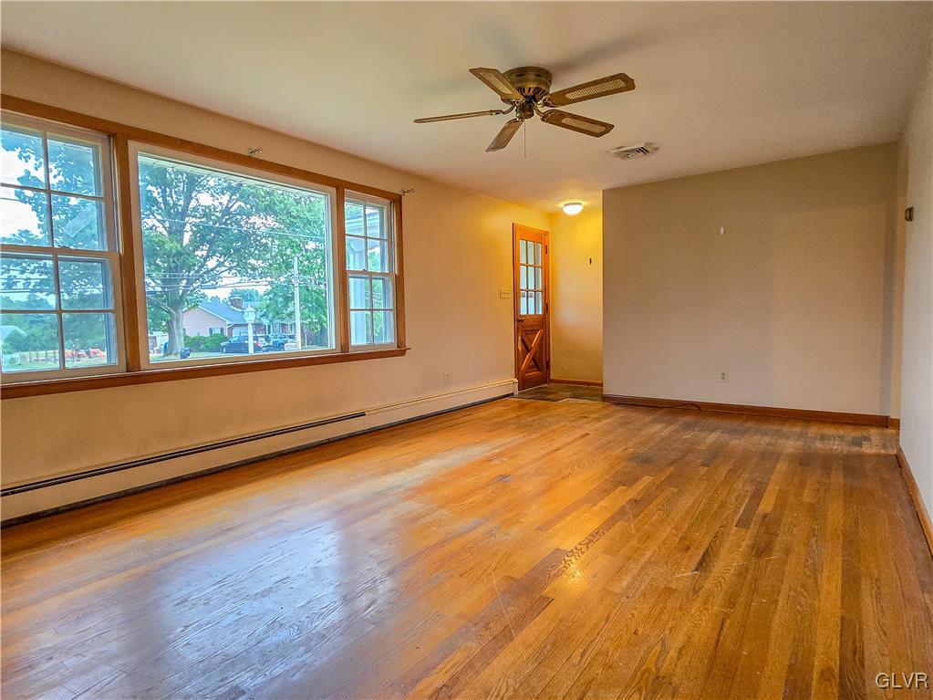 407 Cherry Hill Road Nazareth, PA 18064 - Photo 29 of 45 a view of empty room with wooden floor and fan