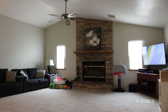 807 James Street Ridgecrest, CA 93555 - Photo 6 of 37 a living room with furniture and a fireplace