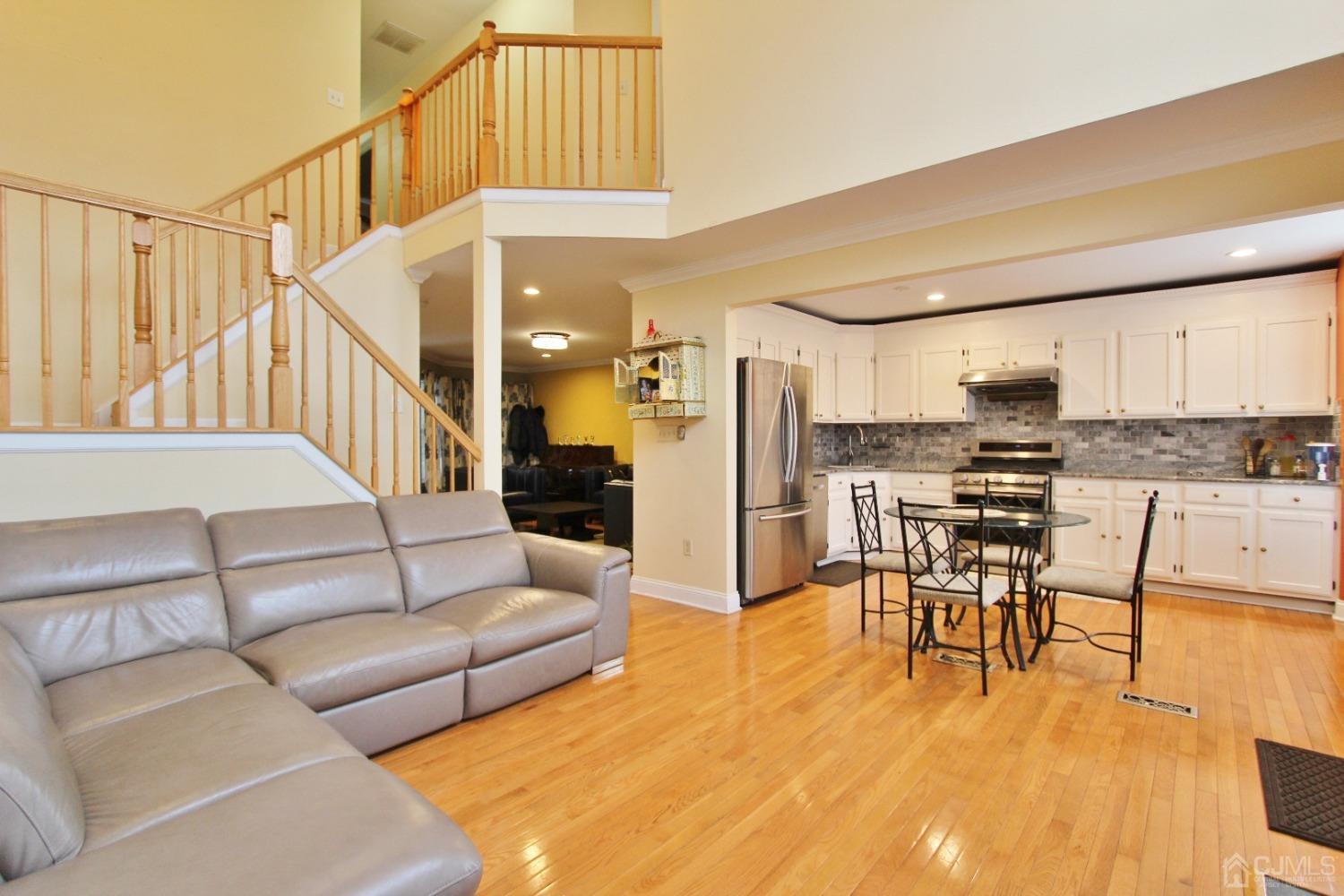 323 Hawthorne Road North Brunswick, NJ 08902 - Photo 11 of 29 a living room with furniture and kitchen view