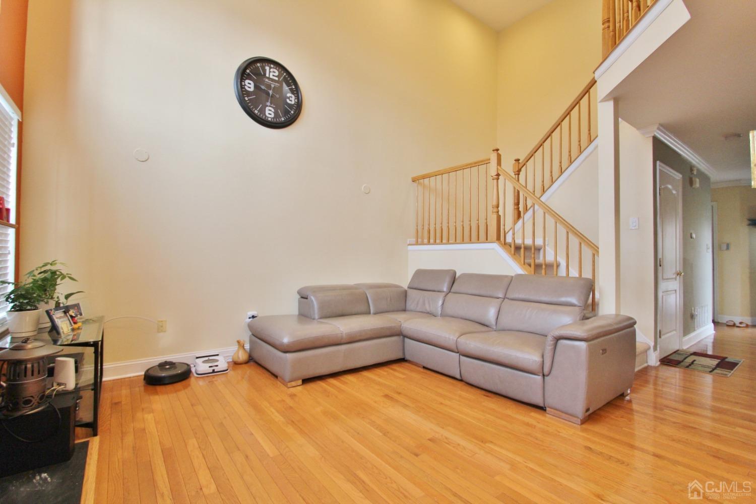 323 Hawthorne Road North Brunswick, NJ 08902 - Photo 12 of 29 a living room with furniture and a wooden floor
