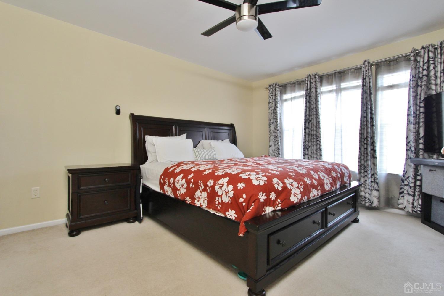 323 Hawthorne Road North Brunswick, NJ 08902 - Photo 14 of 29 a bed sitting in a bedroom next to a window