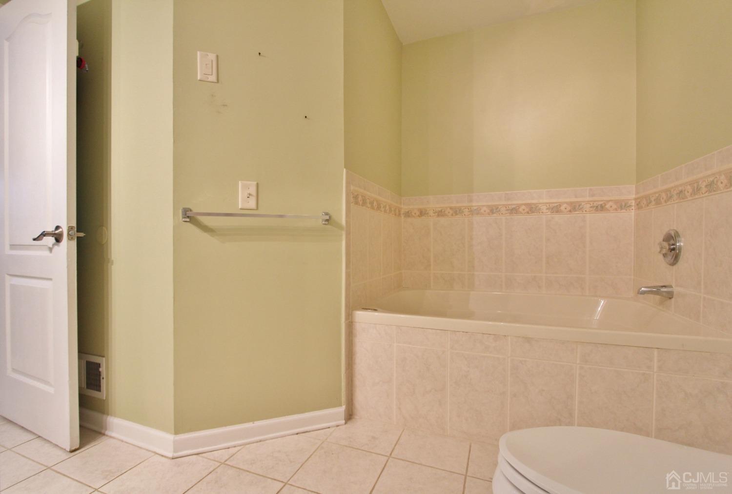 323 Hawthorne Road North Brunswick, NJ 08902 - Photo 16 of 29 a bathroom with a toilet and a shower