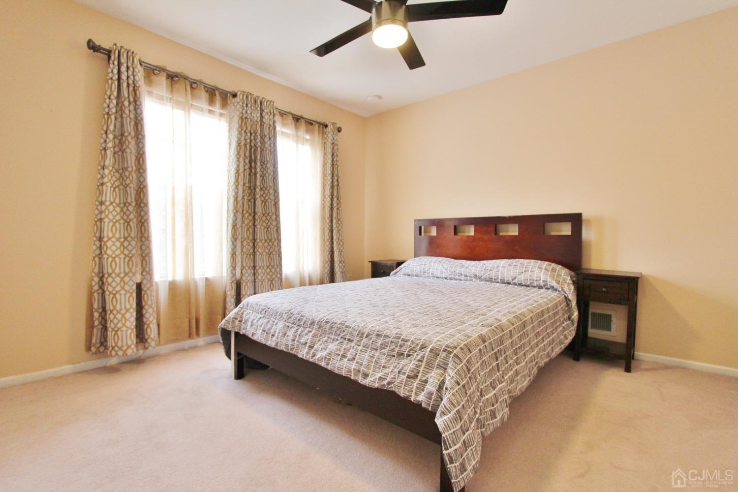 323 Hawthorne Road North Brunswick, NJ 08902 - Photo 17 of 29 a bedroom with a bed and window