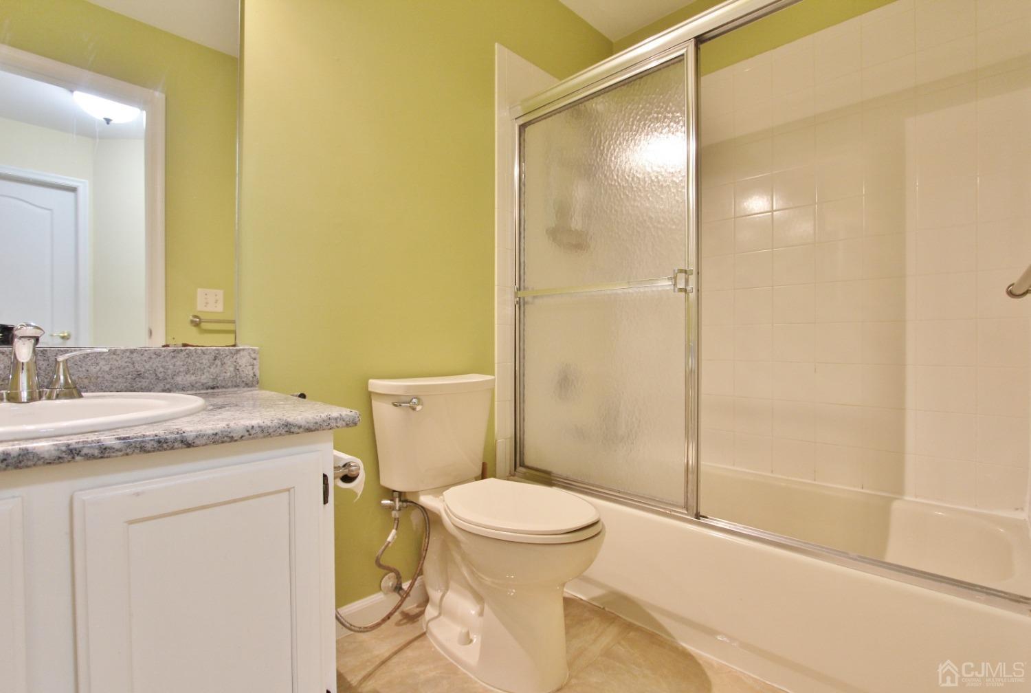 323 Hawthorne Road North Brunswick, NJ 08902 - Photo 19 of 29 a bathroom with a granite countertop sink toilet and shower