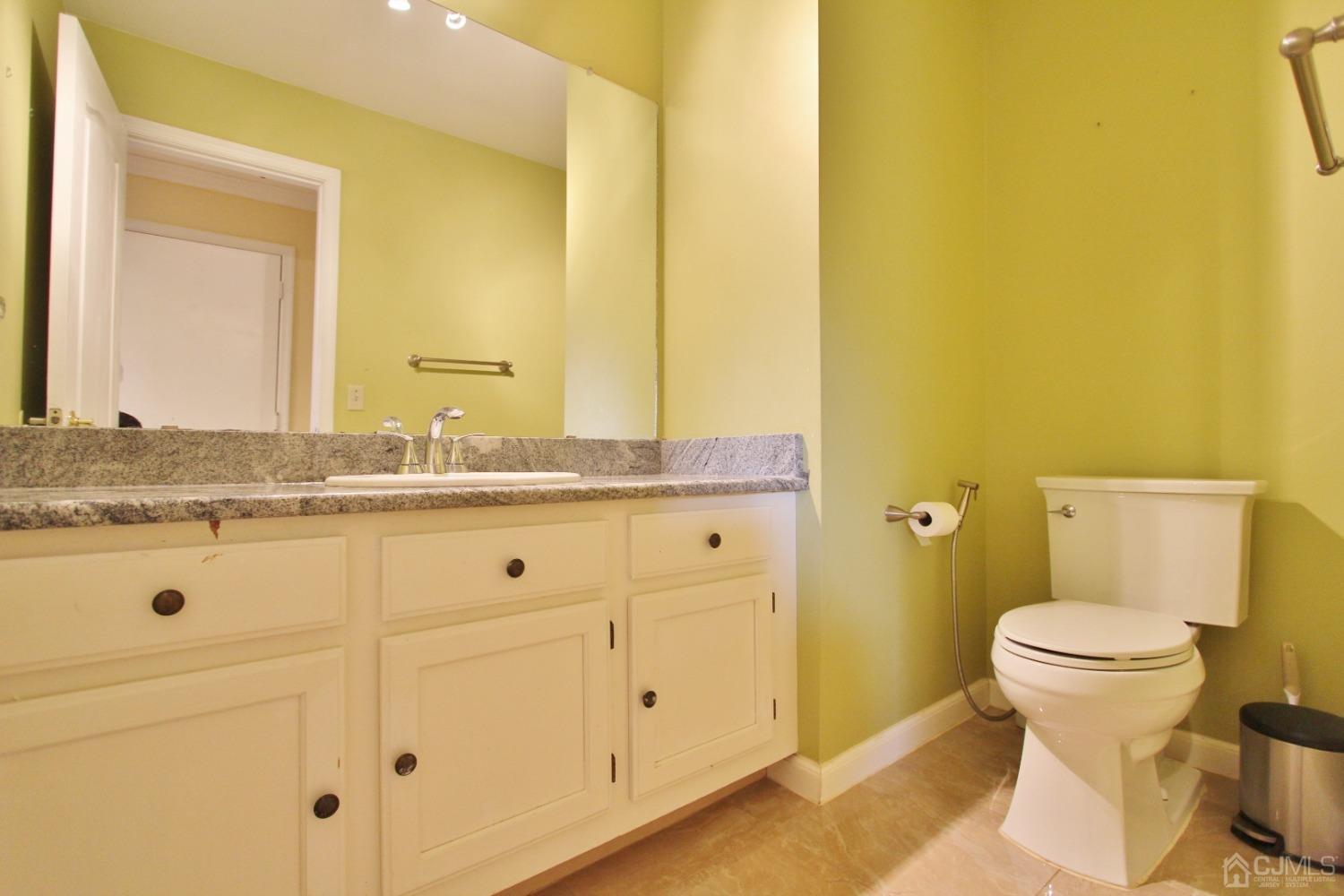 323 Hawthorne Road North Brunswick, NJ 08902 - Photo 22 of 29 a bathroom with a granite countertop sink and a mirror