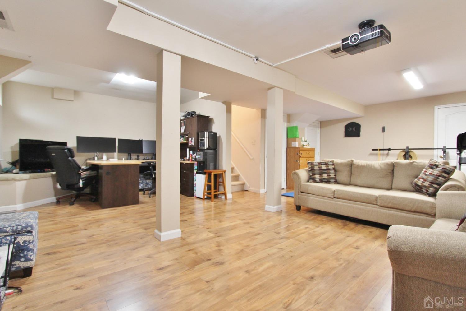 323 Hawthorne Road North Brunswick, NJ 08902 - Photo 23 of 29 a living room with furniture and a wooden floor