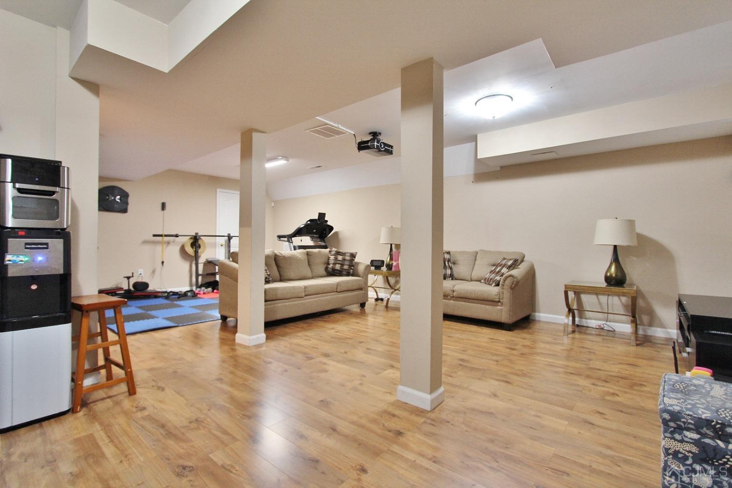 323 Hawthorne Road North Brunswick, NJ 08902 - Photo 24 of 29 a living room with furniture and a wooden floor