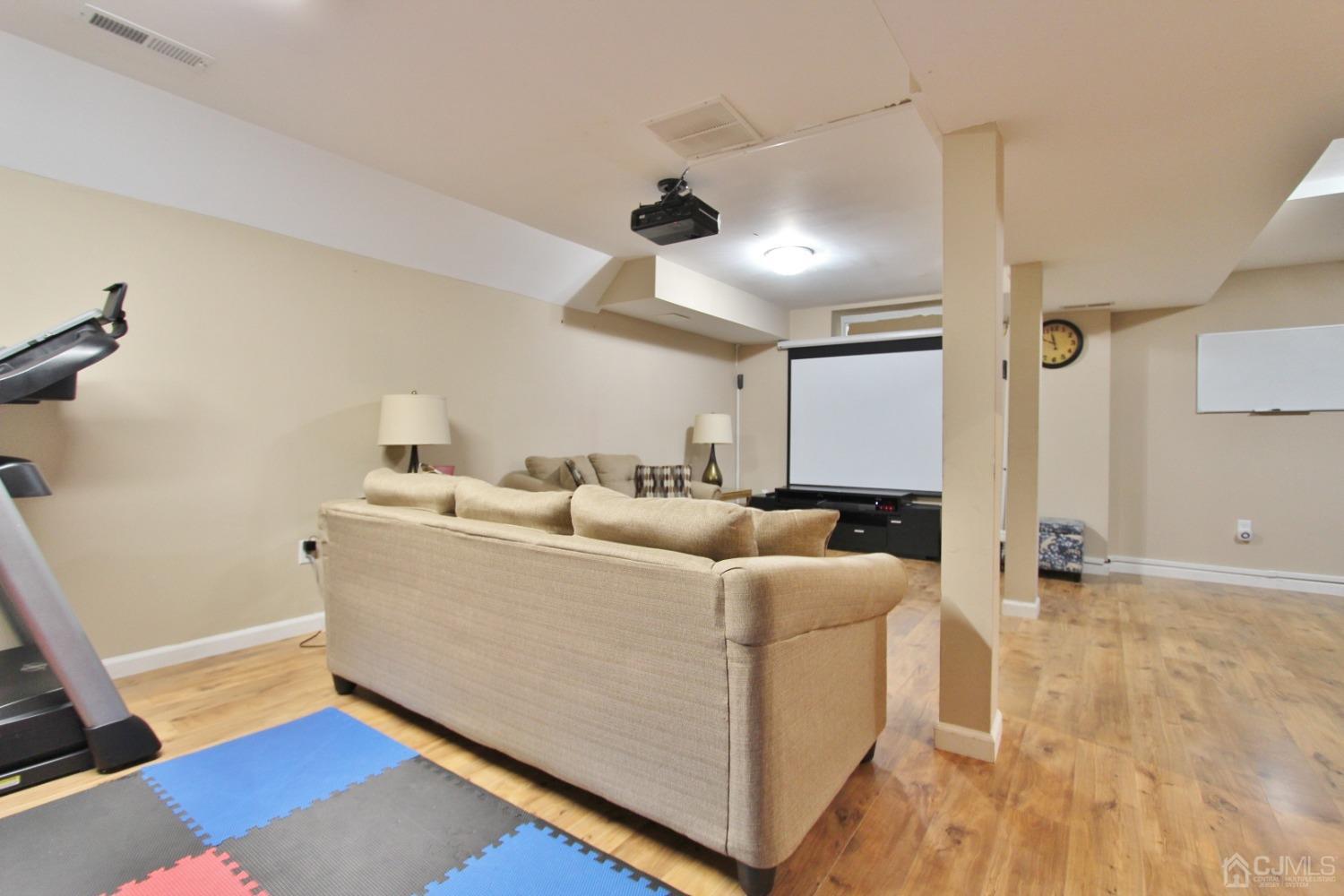 323 Hawthorne Road North Brunswick, NJ 08902 - Photo 25 of 29 a living room with furniture and a wooden floor