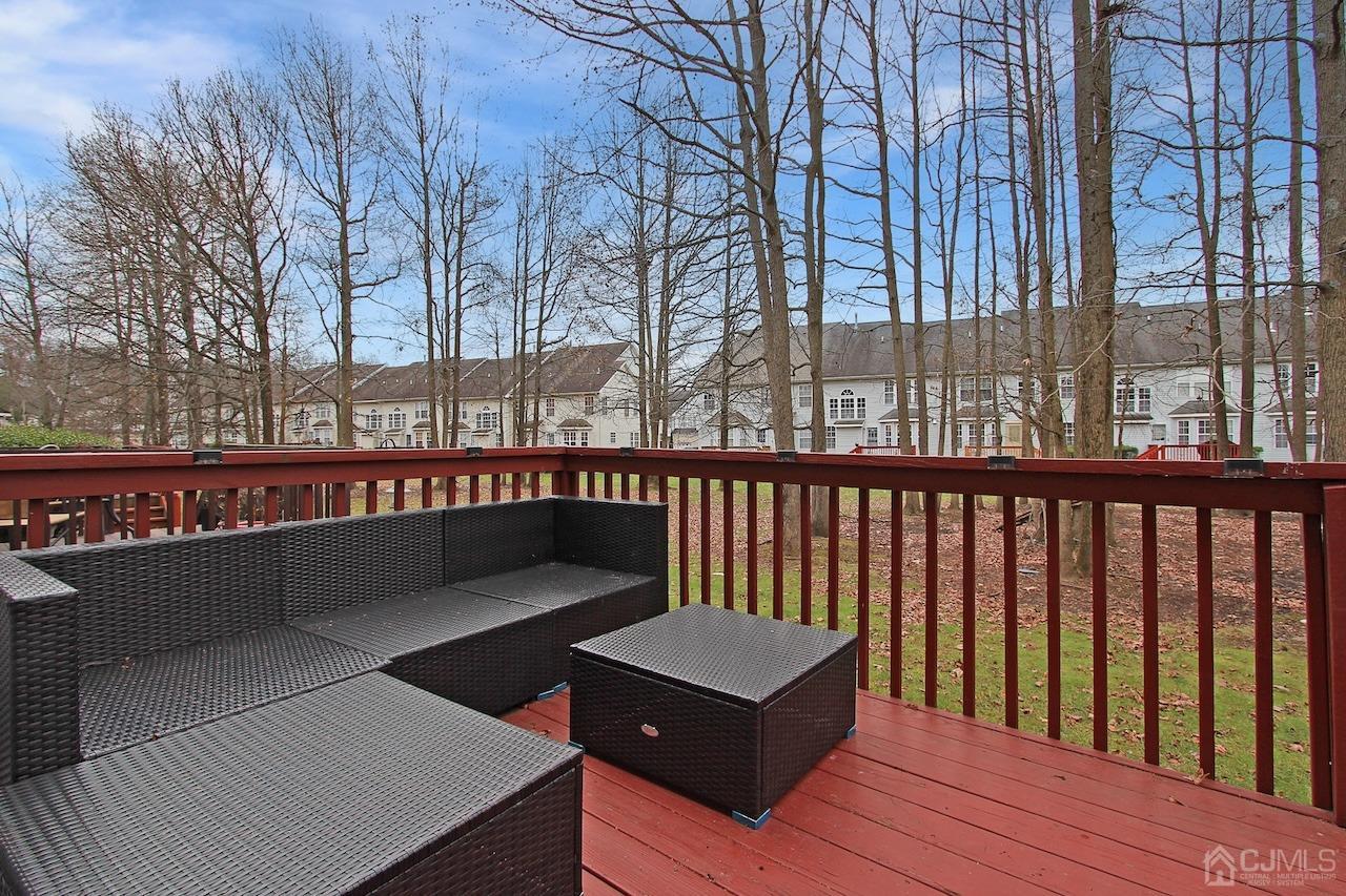 323 Hawthorne Road North Brunswick, NJ 08902 - Photo 26 of 29 a view of a wooden deck with a bench