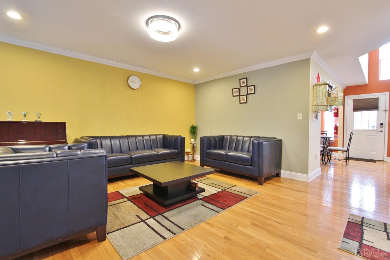 323 Hawthorne Road North Brunswick, NJ 08902 - Photo 3 of 29 a living room with furniture and a table