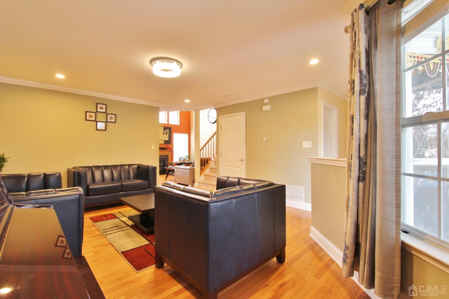 323 Hawthorne Road North Brunswick, NJ 08902 - Photo 5 of 29 a view of a living room with furniture and a flat screen tv