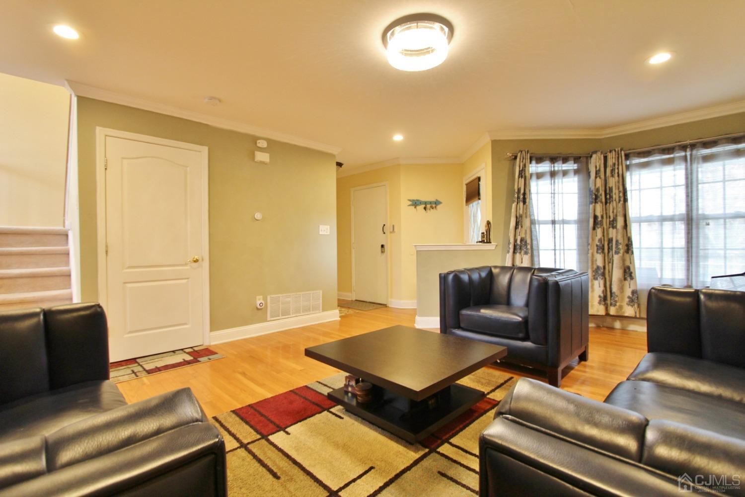 323 Hawthorne Road North Brunswick, NJ 08902 - Photo 6 of 29 a living room with furniture and a window