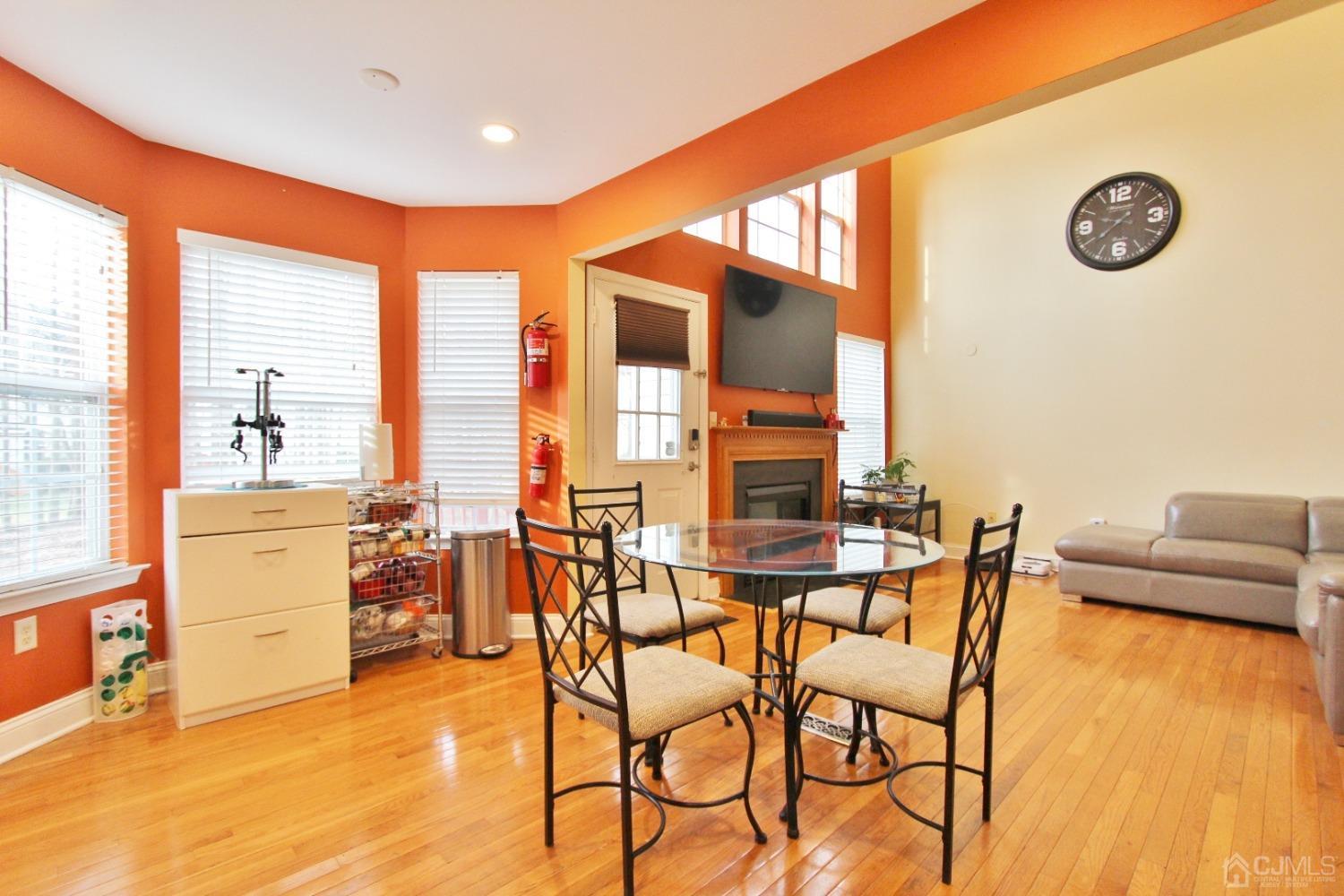 323 Hawthorne Road North Brunswick, NJ 08902 - Photo 9 of 29 a dining room with furniture and a floor to ceiling window