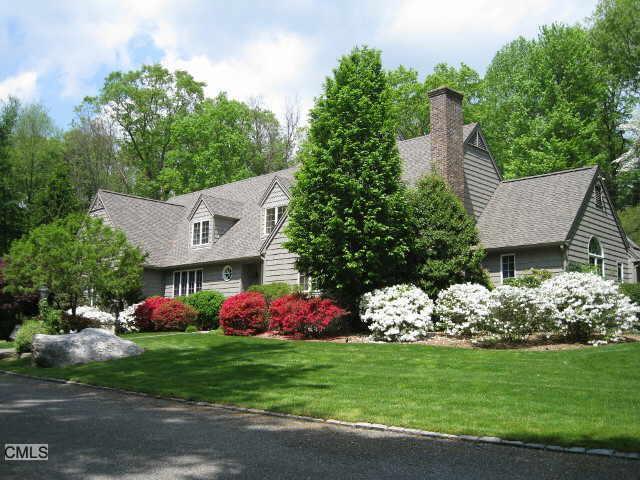 357 Frogtown Road New Canaan, CT 06840 - Photo 1 of 1 a front view of a house with garden