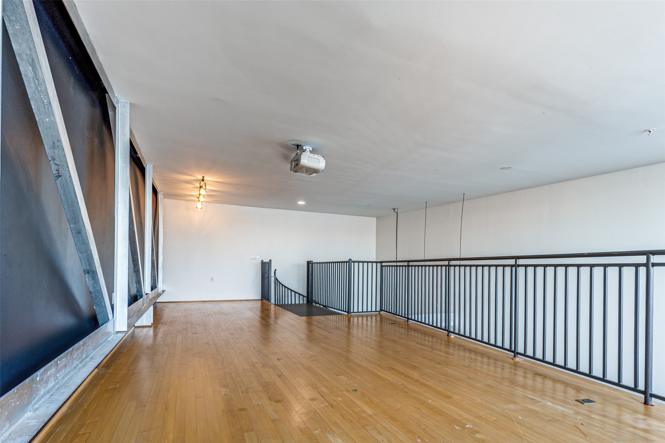 1312 Live Oak Street, Unit 223 Houston, TX 77003 - Photo 20 of 25 wooden floor in an empty room with a window