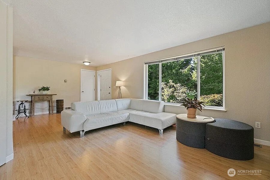 Undisclosed Address Redmond, WA 98052 - Photo 13 of 31 a living room with furniture and a large window