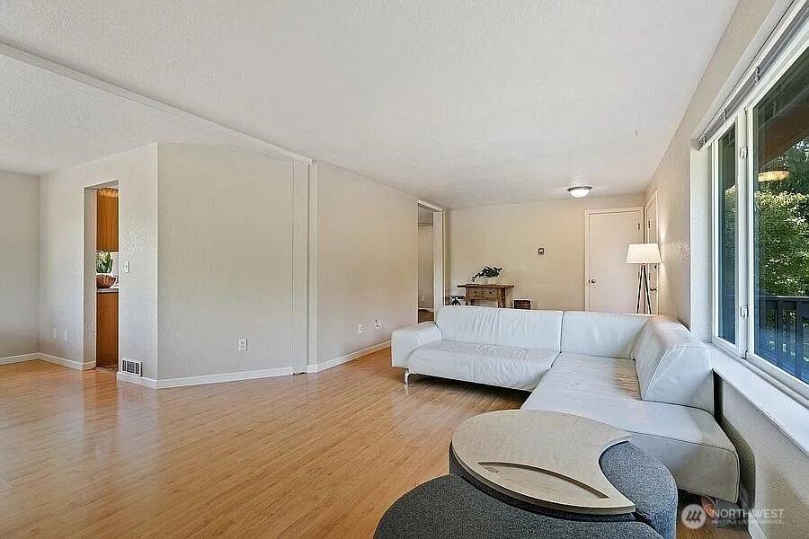 Undisclosed Address Redmond, WA 98052 - Photo 14 of 31 a living room with furniture and a large window