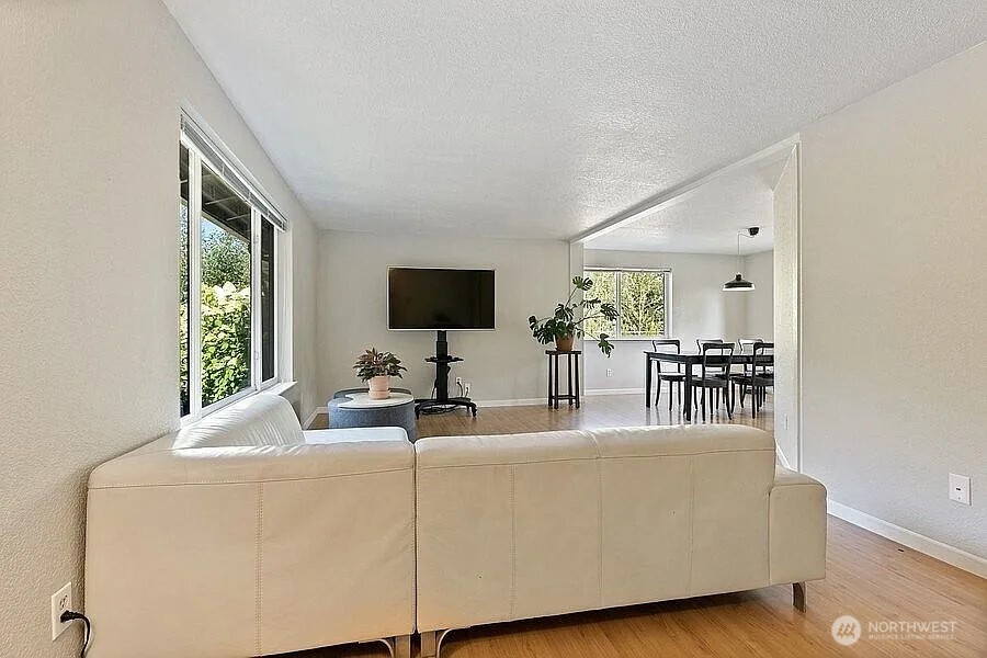 Undisclosed Address Redmond, WA 98052 - Photo 15 of 31 a living room with furniture and a flat screen tv