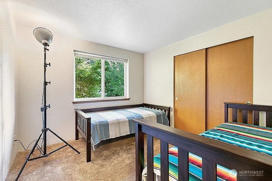 Undisclosed Address Redmond, WA 98052 - Photo 21 of 31 a bedroom with furniture and a window