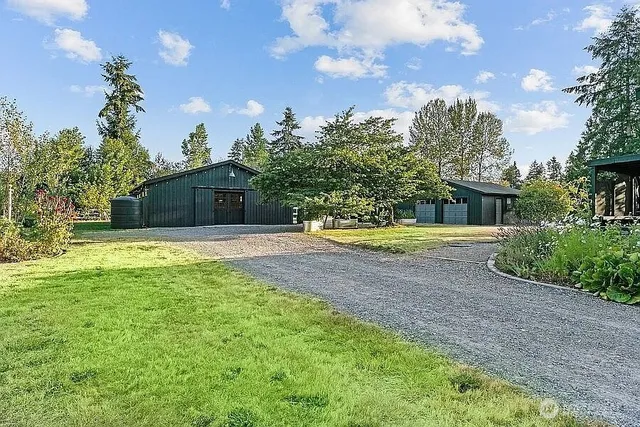 a swimming pool with outdoor seating and yard