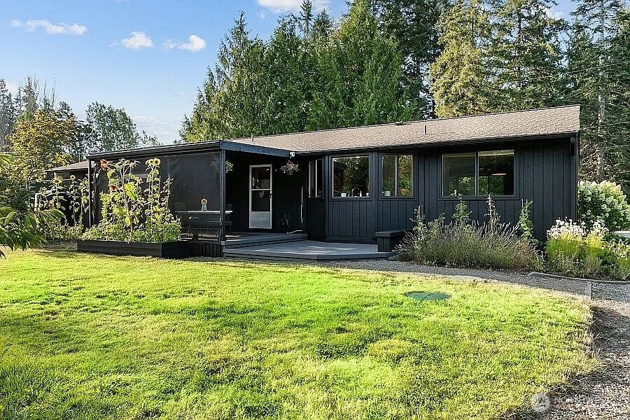 Undisclosed Address Redmond, WA 98052 - Photo 3 of 31 a front view of house with yard and green space