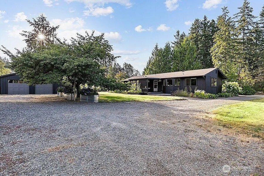 Undisclosed Address Redmond, WA 98052 - Photo 31 of 31 a view of a house with a yard and swimming pool